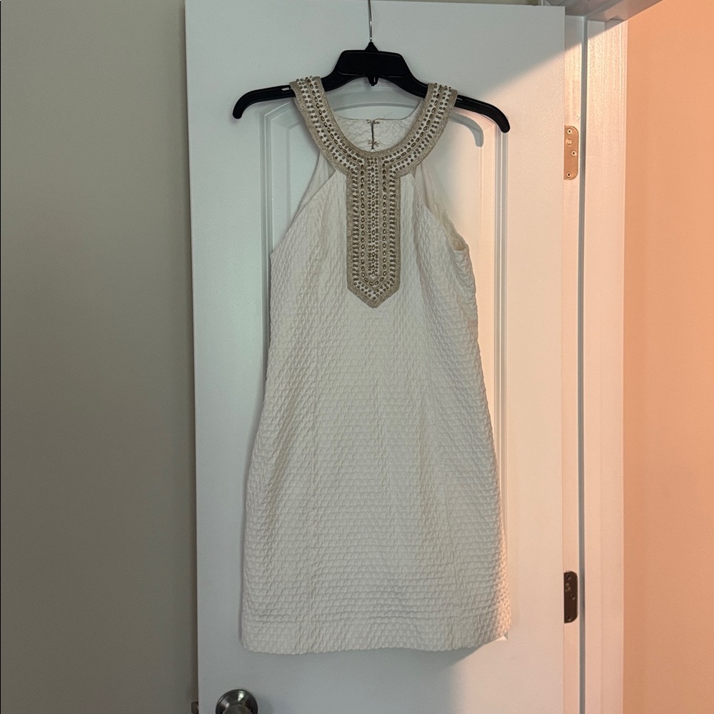Elegant lily Cream Sleeveless Dress with Beaded Neckline.